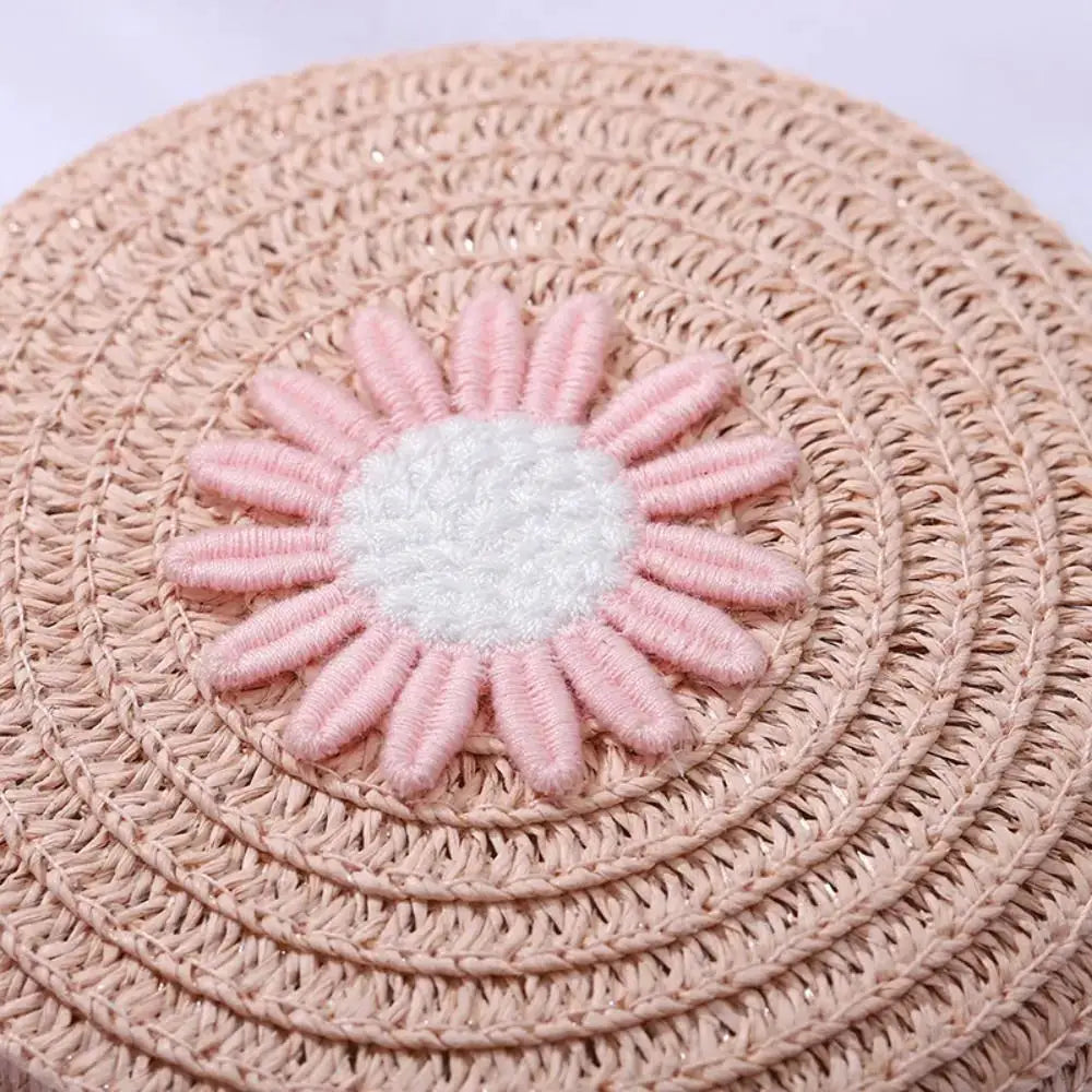 Sac à main rond en rotin naturel avec fleur décorative rose et centre blanc