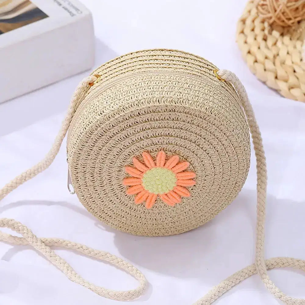 Sac à main rond en rotin naturel avec bandoulière, motif fleur orange sur le devant