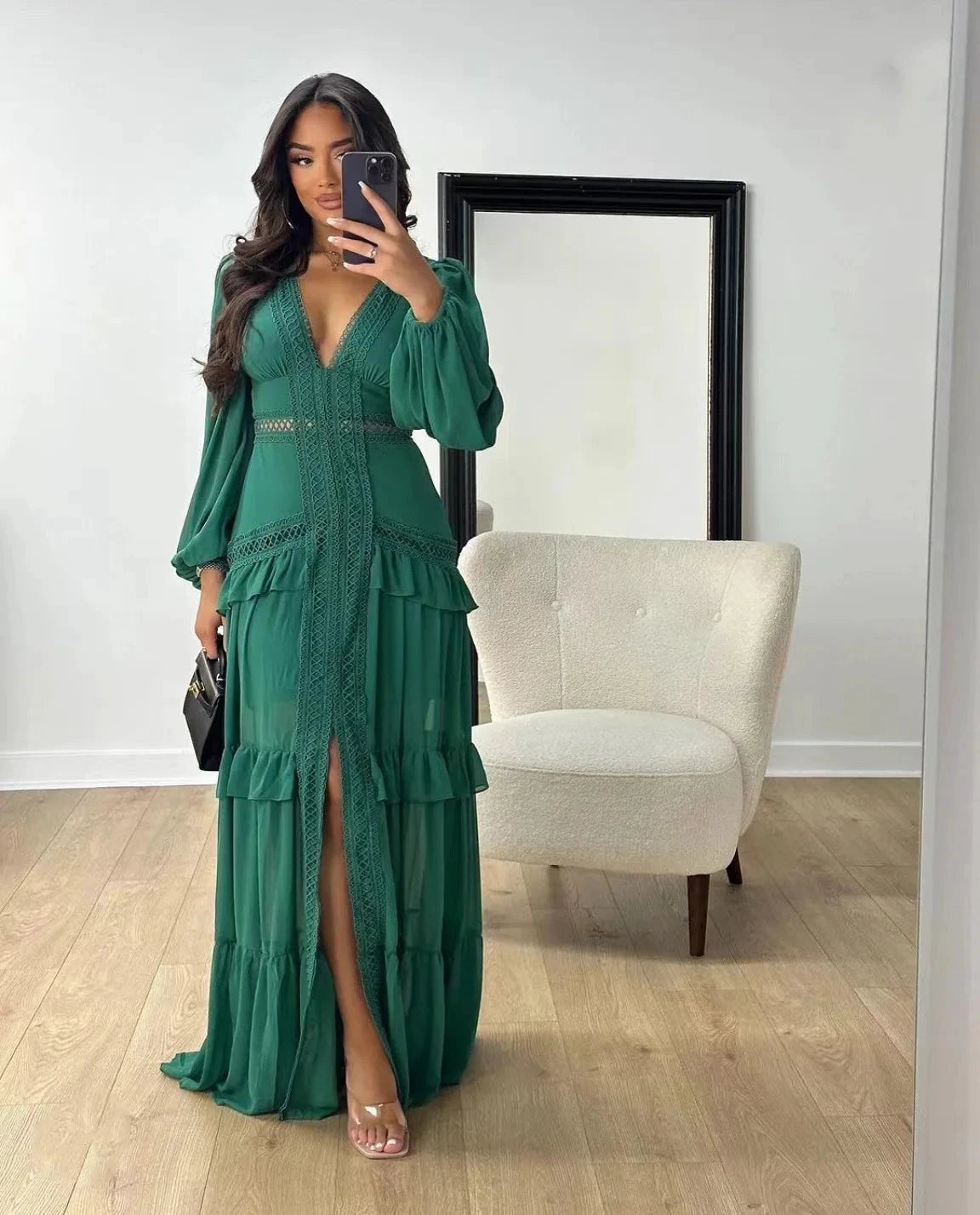 Long, openwork dress with a V-neck, empire waist, and lantern sleeves