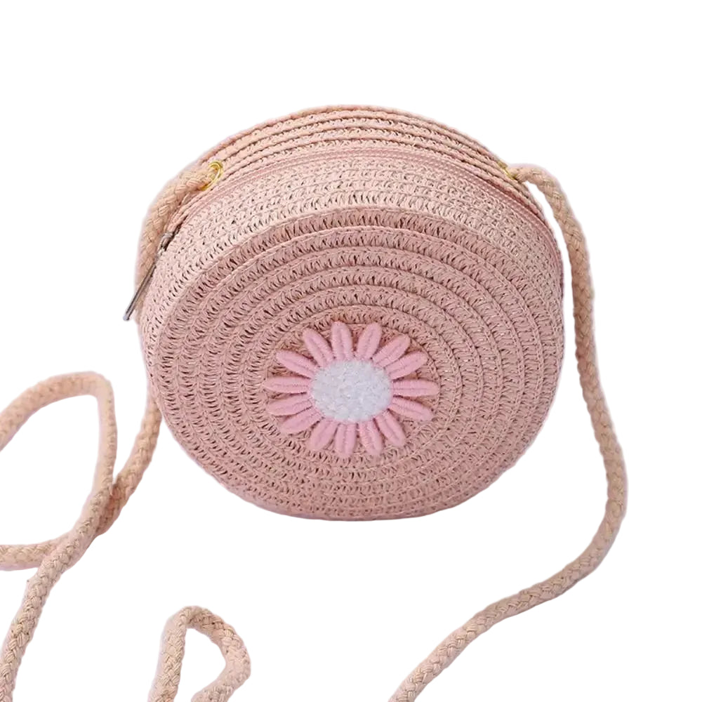 Sac rond en rotin tissé avec bandoulière en corde et fleur rose en tissu, fait à la main