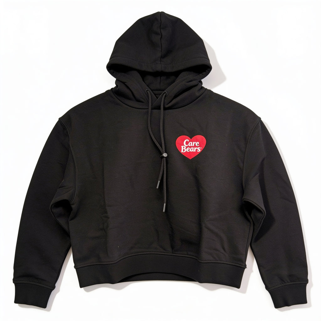 Sweat à capuche Care Bears noir présenté à plat sur fond blanc